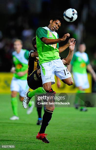 Fred Aigus of the Fury contests the ball with Nicky Travis of the Mariners during the round 15 A-League match between North Queensland Fury and the...