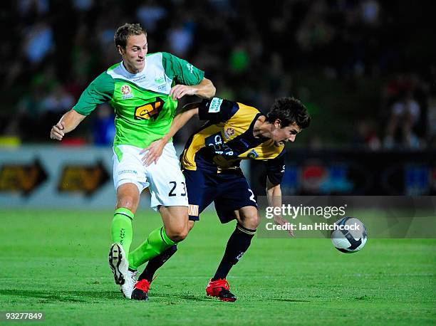 Roystyn Griffiths of the Fury contests the ball with Nicky Travis of the Mariners during the round 15 A-League match between North Queensland Fury...