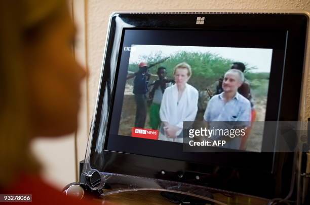Woman watches video footage on November 21, 2009 of the British couple that were kidnapped while sailing off the coast of Somalia. Paul and Rachel...