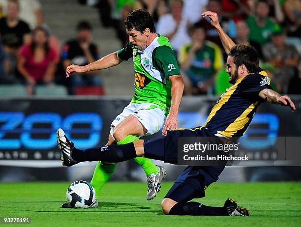 Robbie Middleby of the Fury is tackled by Dean Heffernan of the Mariners during the round 15 A-League match between North Queensland Fury and the...