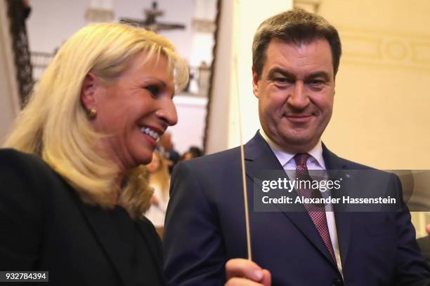 Markus Soeder of the Bavarian Christian Democrats and the new Governor of Bavaria smiles with his iwfe Karin Soeder at the Bavarian state parliament...