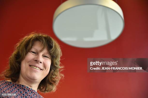 Romane Didier, press officer of kart drivers, poses for a photograph on March 3, 2018 in Le Mans. Former karting pilot and transgender Romane Didier...