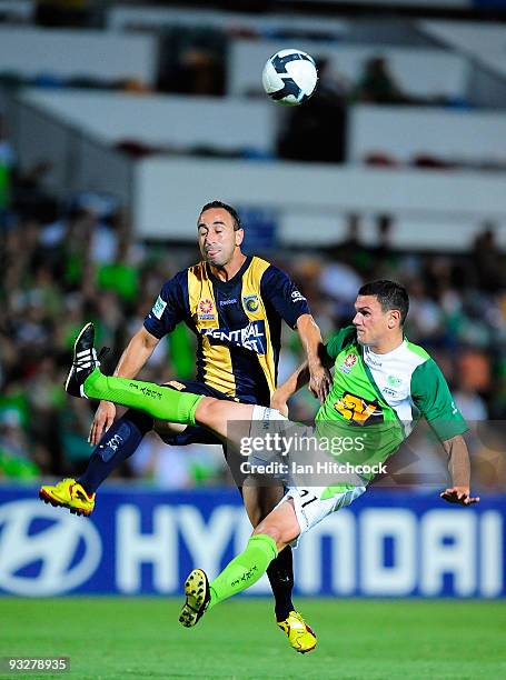 Ahmed Elrich of the Mariners contests the ball with John Tambouras of the Fury during the round 15 A-League match between North Queensland Fury and...