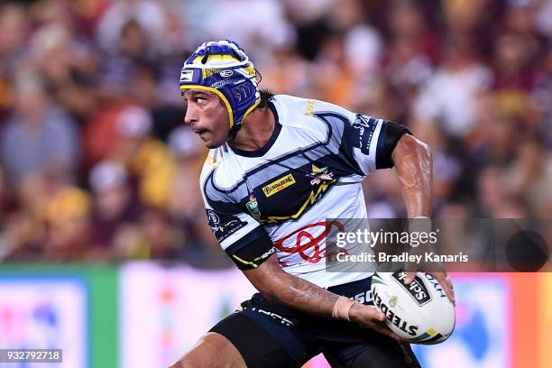 Johnathan Thurston of the Cowboys passes the ball during the round two NRL match between the Brisbane Broncos and the North Queensland Cowboys at...