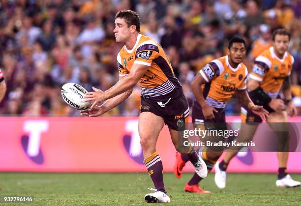 Andrew McCullough of the Broncos passes the ball during the round two NRL match between the Brisbane Broncos and the North Queensland Cowboys at...