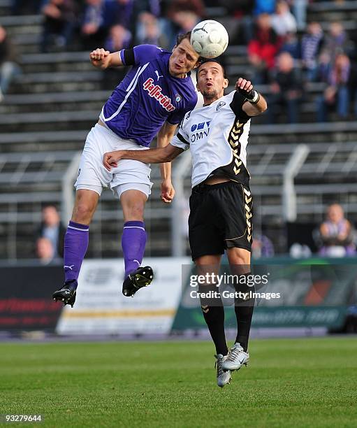 Marc Hensel of FC Erzgebirge Aue and Christian Holzer of SV Wacker Burghausen battle for the ball during the 3. Liga match between Erzgebirge Aue and...