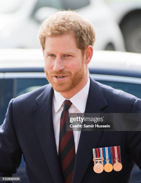 Prince Harry arrives to present 12 pilots from Course 17/02 of the Army Air Corps with their Wing during a ceremony at Museum of Army Flying on March...