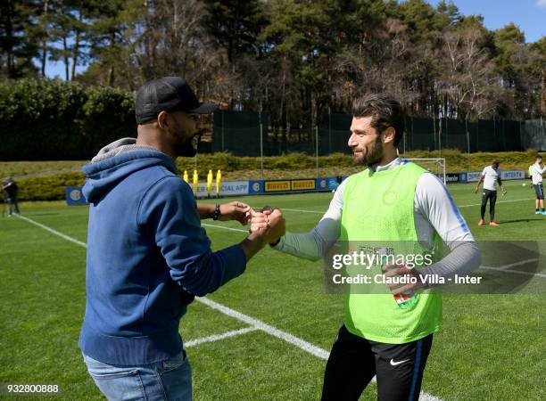 Antonio Candreva of FC Internazionale and Maicon chat during the FC Internazionale training session at the club's training ground Suning Training...