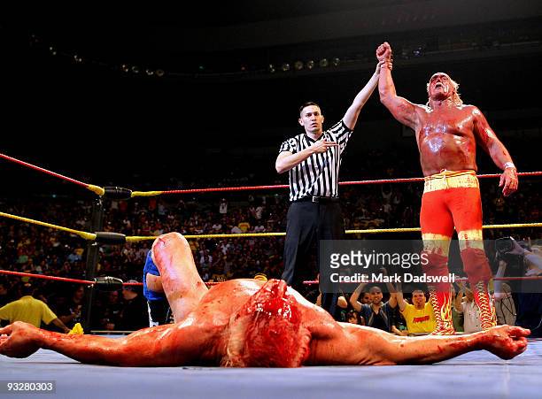 Hulk Hogan is declared the winner as his opponent Ric Flair lays flat on the floor during Hulk Hogan's Hulkamania Tour at Rod Laver Arena on November...