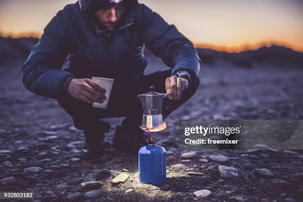 making coffee on camping - camping stove stock pictures, royalty-free photos & images
