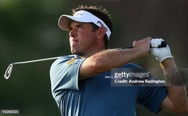 Lee Westwood of England plays his second shot on the 16th hole during the third round of the Dubai World Championship on the Earth Course, Jumeirah...