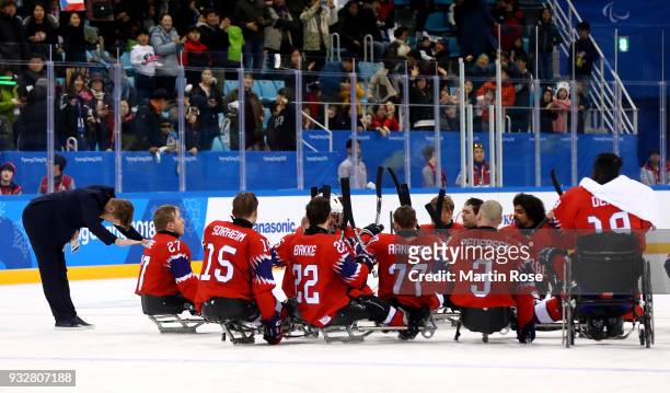 Espen Hegde , head coach of Norway celebrate with his team after the Ice Hockey classification game between Norway and Czech Republic during day...