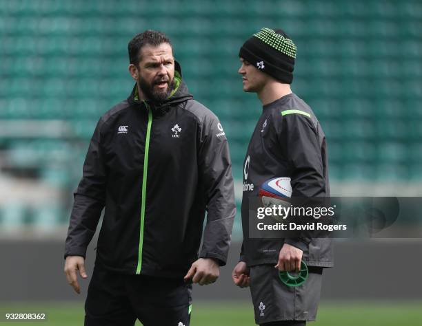 Andy Farrell, the Ireland defence coach talks to Jonathan Sexton during the Ireland captain's run at Twickenham Stadium on March 16, 2018 in London,...