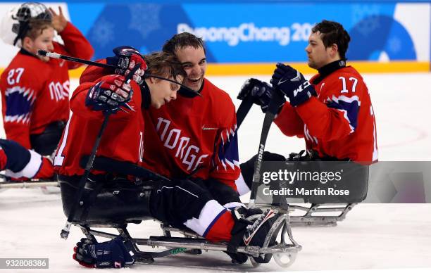 Audun Bakke of Norway celebrate with team mate Ola Oiseth after the Ice Hockey classification game between Norway and Czech Republic during day seven...