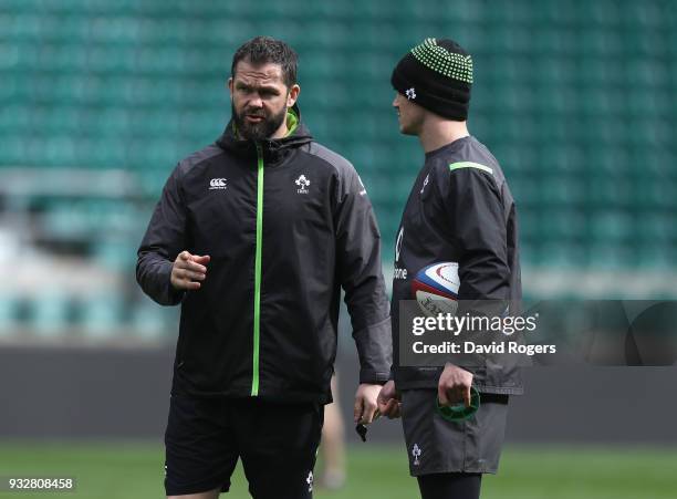 Andy Farrell, the Ireland defence coach talks to Jonathan Sexton during the Ireland captain's run at Twickenham Stadium on March 16, 2018 in London,...