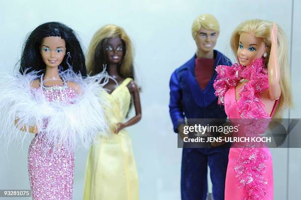 Barbie and Ken dolls are on display at the exhibition "50 years of Barbie" in the eastern German town of Schmalkalden on November 21, 2009. The...