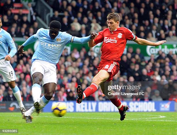 Steven Gerrard captain of Liverpool competes with Kolo Toure captain of Manchester City during the Barclays Premier League match between Liverpool FC...