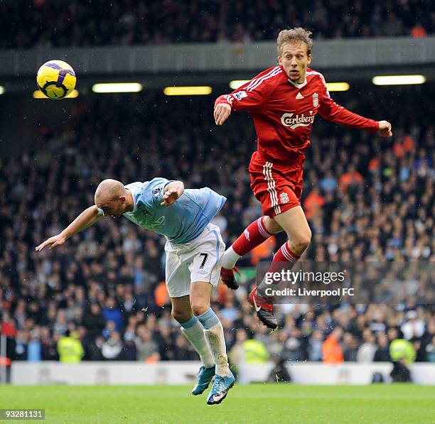 Lucas Levia of Liverpool goes up with Stephen Ireland of Mnchester City during the Barclays Premier League match between Liverpool FC and Manchester...