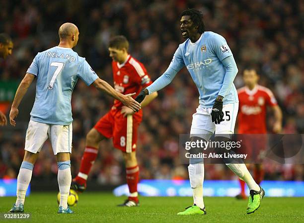 Emmanuel Adebayor of Manchester City is congratulated by Stephen Ireland of Manchester City after he scored his team's first goal during the Barclays...