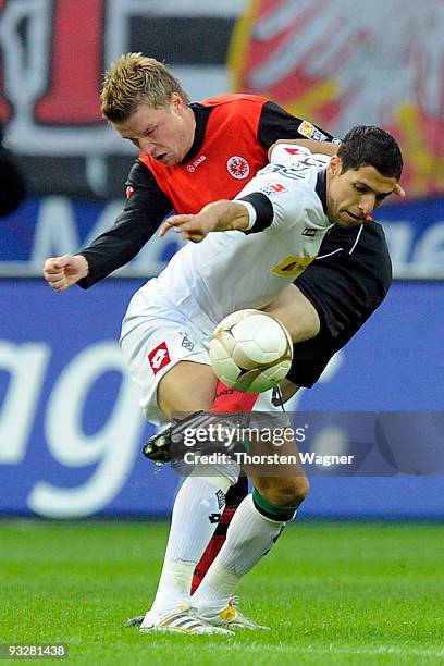 Maik Franz of Frankfurt battles for the ball with Karim Matmour of Moenchengladbach during the Bundesliga match between Eintracht Frankfurt and...