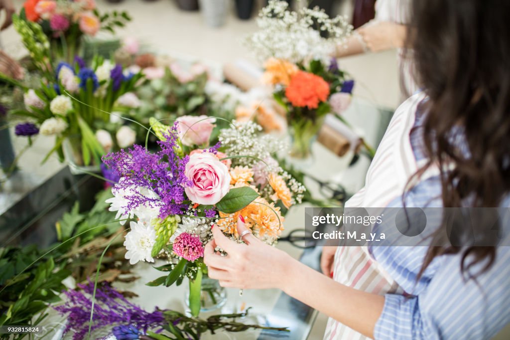 Woman making floral decorations