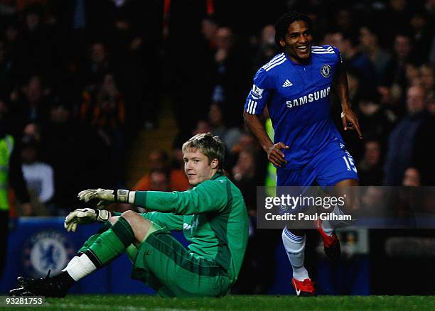 Florent Malouda of Chelsea celebrates his goal as goalkeeper Wayne Hennessey of Wolverhampton Wanderers looks dejected during the Barclays...