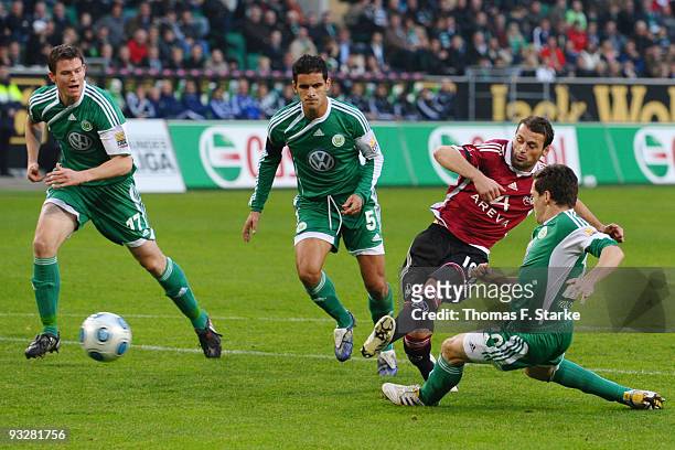 Alexander Madlung and Ricardo Costa of Wolfsburg, Albert Bunjaku of Nuernberg and Sascha Riether of Wolfsburg in action during the Bundesliga match...