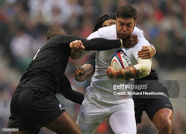 Matt Banahan of England is tackled by Sitiveni Sivivatu and Ma'a Nonu of New Zealand during the Investec Challenge Series match between England and...