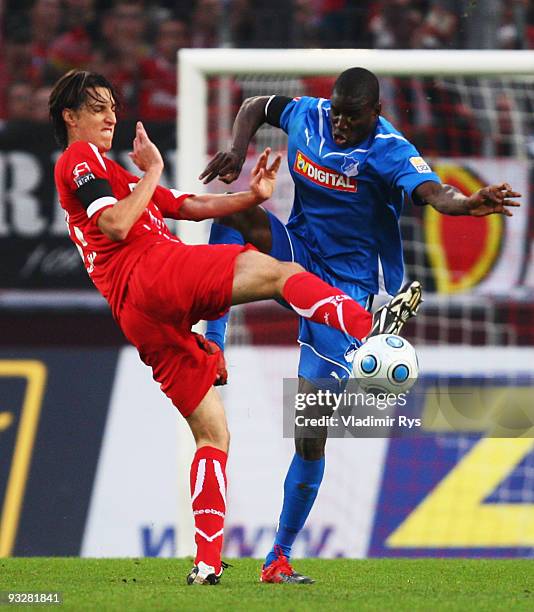 Pedro Geromel of Koeln and Demba Ba of Hoffenheim battle for the ball during the Bundesliga match between 1. FC Koeln and 1899 Hoffenheim at...