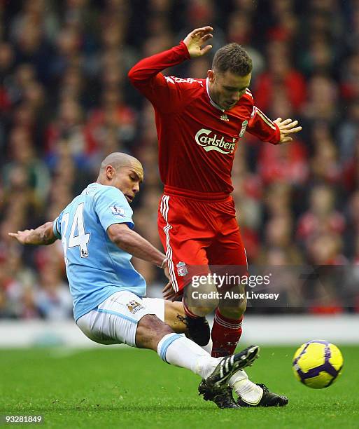 Nigel de Jong of Manchester City tackles Fabio Aurelio of Liverpool during the Barclays Premier League match between Liverpool and Manchester City at...