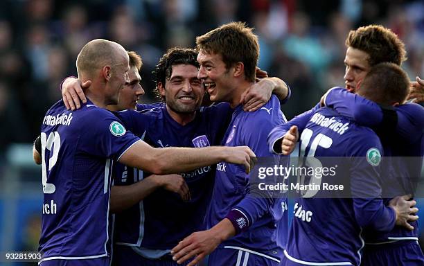 Angelo Barletta of Osnabruck celebrates with his team mates after the third Bundesliga match between VfL Osnabrueck and Borussia Dortmund II at...