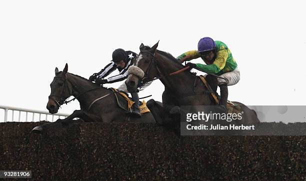 Ruby Walsh and Kauto Star clear the last fence in company with the Paddy Brennan ridden Imperial Commander before wining The Betfair Steeple Chase...