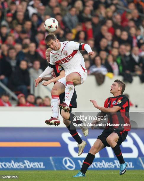 Thomas Hitzlsperger of Stuttgart battles for the ball with Sascha Bigalke of Berlin and his team mate Lukasz Piszczek during the Bundesliga match...