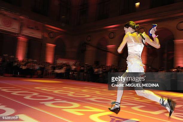Woman competes for the "Race on Heels" on November 20, 2009 in Paris.A total 96 shoe addicts, a common condition with fashionistas, have signed up...