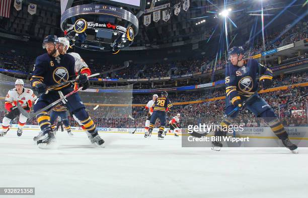 Marco Scandella and Rasmus Ristolainen of the Buffalo Sabres skate during an NHL game against the Calgary Flames on March 7, 2018 at KeyBank Center...