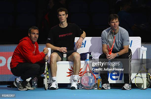 Andy Murray of Great Britain in action in a practice session as coach, Miles Maclagan looks on with Alex Corretja of Spain during the Barclays ATP...