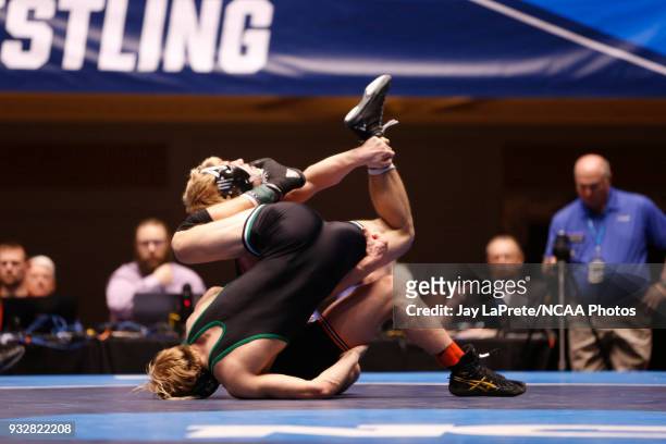 Cross Cannone, of Wartburg, wrestles Gregory Warner, of York, in the 149 weight class during the Division III Men's Wrestling Championship held at...