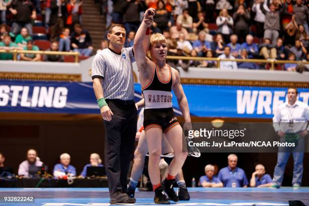 Cross Cannone, of Wartburg, is declared the winner after defeating Gregory Warner, of York, in the 149 weight class during the Division III Men's...