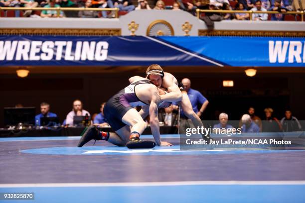 Jordan Newman, of Wisconsin-Whitewater, wrestles Tyler Lutes, of Wartburg, in the 184 weight class during the Division III Men's Wrestling...