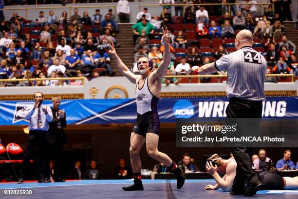 Jordan Newman, of Wisconsin-Whitewater, celebrates after beating Tyler Lutes, of Wartburg, in the 184 weight class during the Division III Men's...