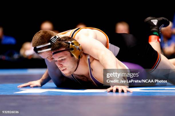 Kyle Fank, of Wartburg, wrestles Guy Patron, of Loras, in the 197 weight class during the Division III Men's Wrestling Championship held at the...