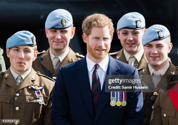 Prince Harry presents 12 pilots from Course 17/02 of the Army Air Corps with their Wing during a ceremony at Museum of Army Flying on March 16, 2018...