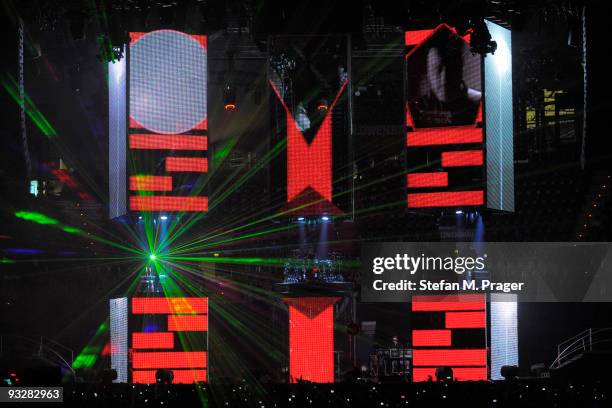 Matthew Bellamy, Dominic Howard and Christopher Wolstenholme perform on stage at Olympiahalle on November 20, 2009 in Munich, Germany.