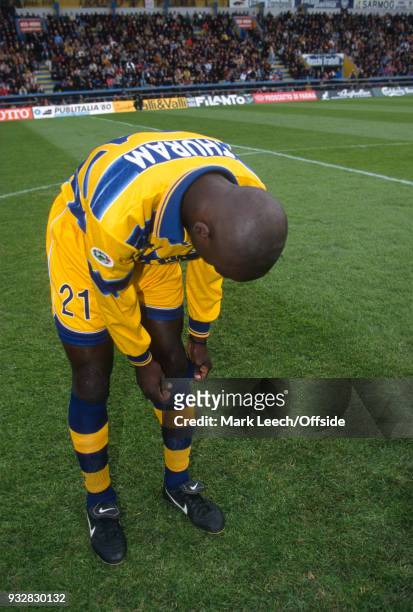 October 1998 Parma, Serie A - Parma v Fiorentina - Lilian Thuram pulls up his socks before the match