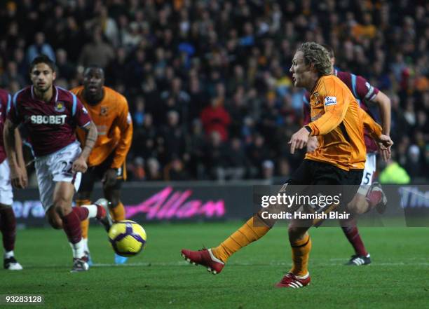 Jimmy Bullard of Hull successfully takes a penalty to score his team's third goal during the Barclays Premier League match between Hull City and West...