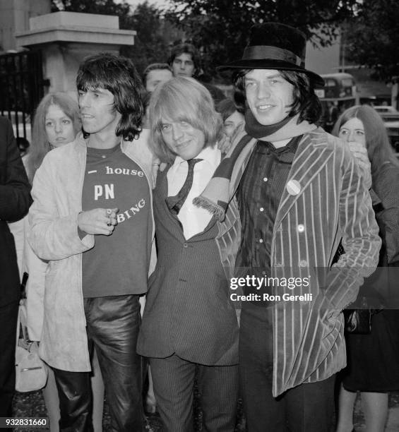 British musician Brian Jones is welcomed by musicians Keith Richards and Mick Jagger, after leaving court after being found guilty on a drug charge...