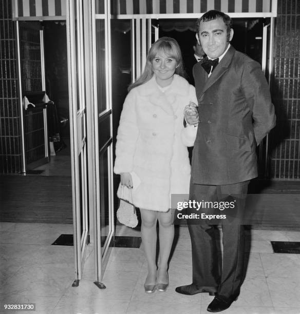 British singer-songwriter Lulu and British writer and composer Lionel Bart attend the premiere of musical drama film 'Oliver!', UK, 26th September...