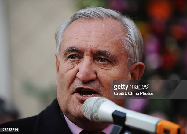 Former French Premier Jean-Pierre Raffarin delivers a speech at the inauguration ceremony of Baomalong International Wine Shop on November 21, 2009...