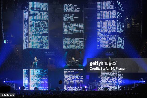 Matthew Bellamy, Dominic Howard and Christopher Wolstenholme perform on stage at Olympiahalle on November 20, 2009 in Munich, Germany.