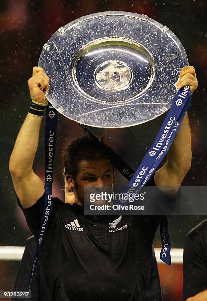 Richie McCaw of New Zealand holds aloft the Hillary Shield after victory in the Investec Challenge Series match between England and New Zealand at...